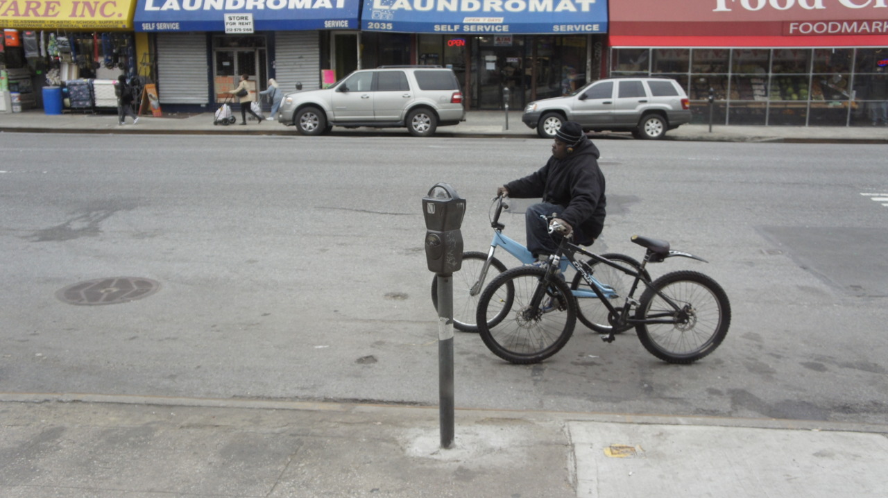 Man on stolen bike with stolen bike on my corner.