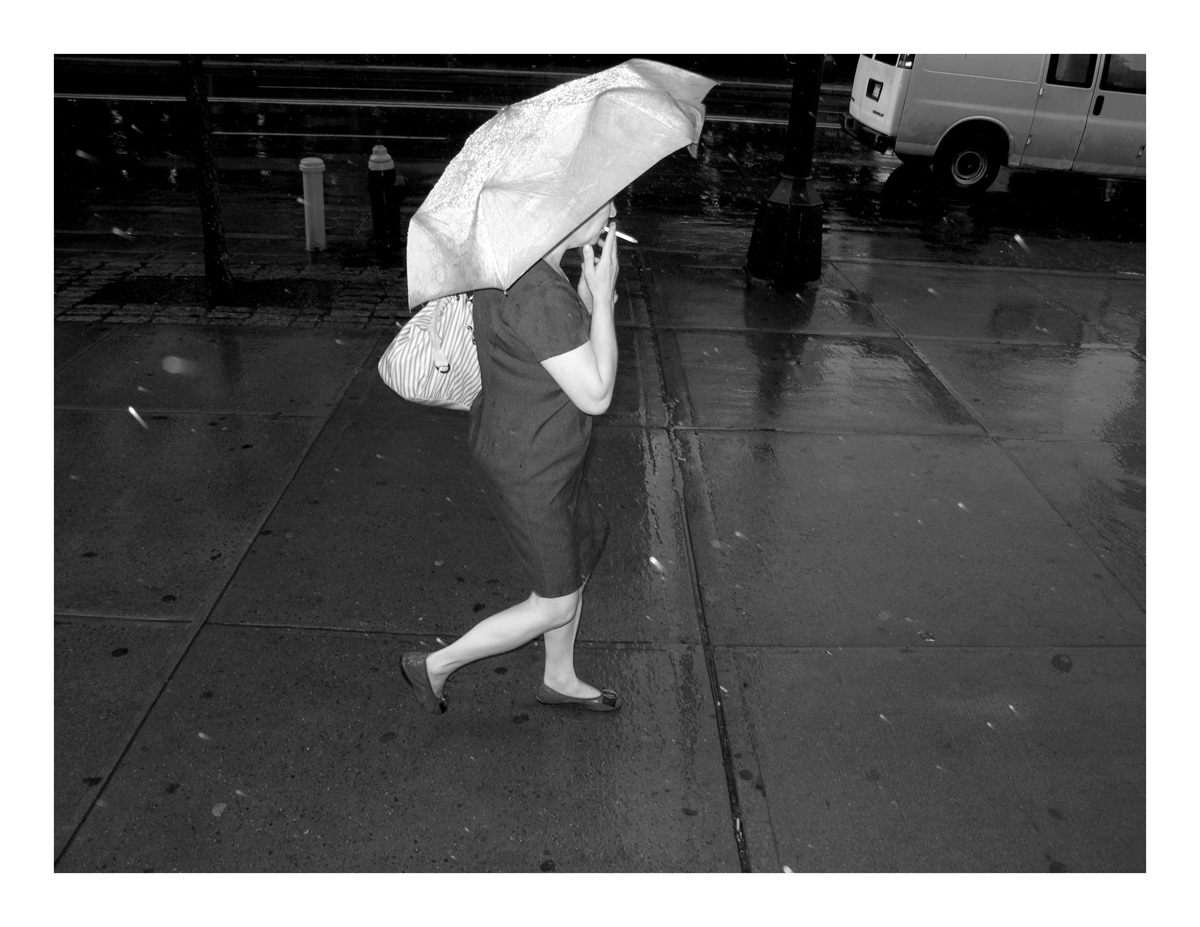 Woman smoking in the rain