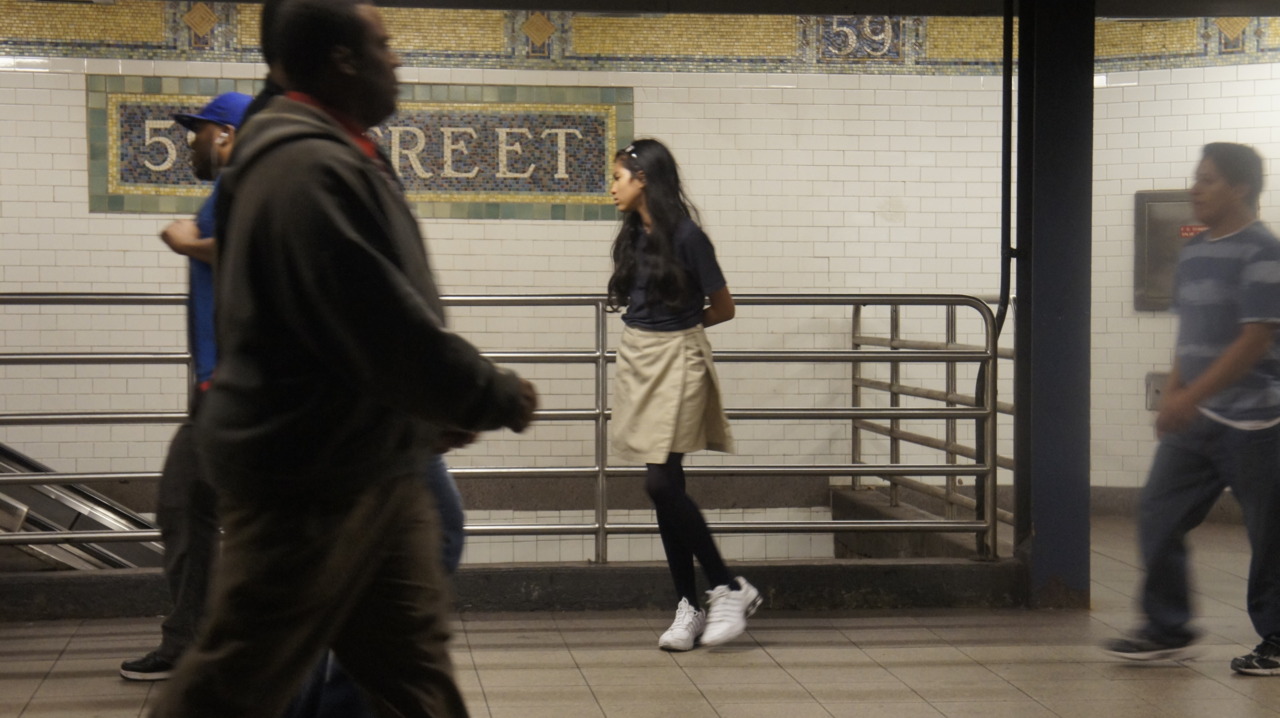 woman under the street with big white shoes